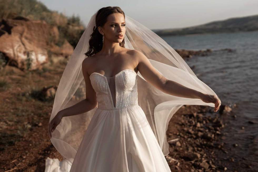 bride in front of a lake