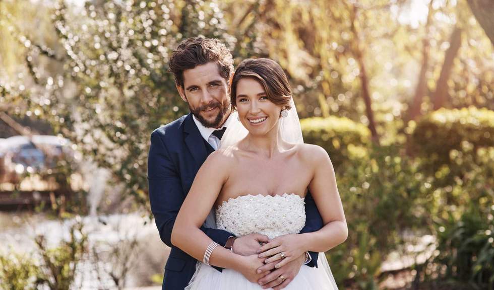 Couple, embrace and portrait in outdoors, commitment and promise of loyalty in marriage. People, hug and celebrate in nature for relationship, support and happy event for partnership or romance union.