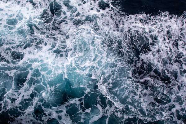 Foamy ocean waves seen from above
