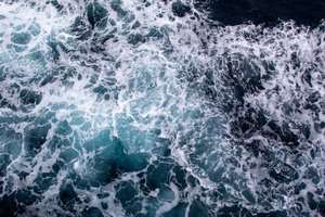Foamy ocean waves seen from above