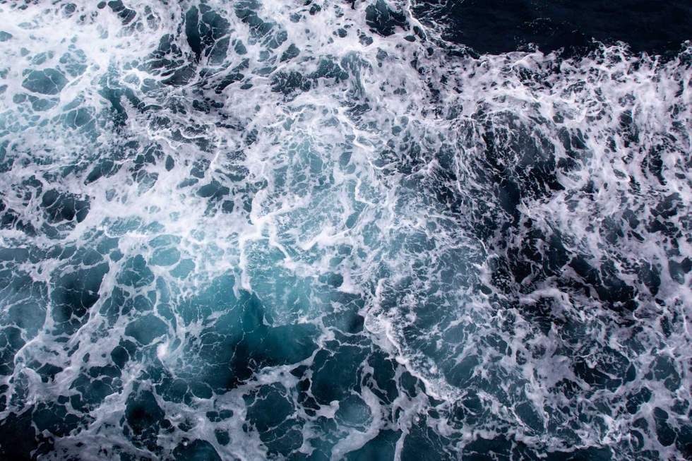 Foamy ocean waves seen from above