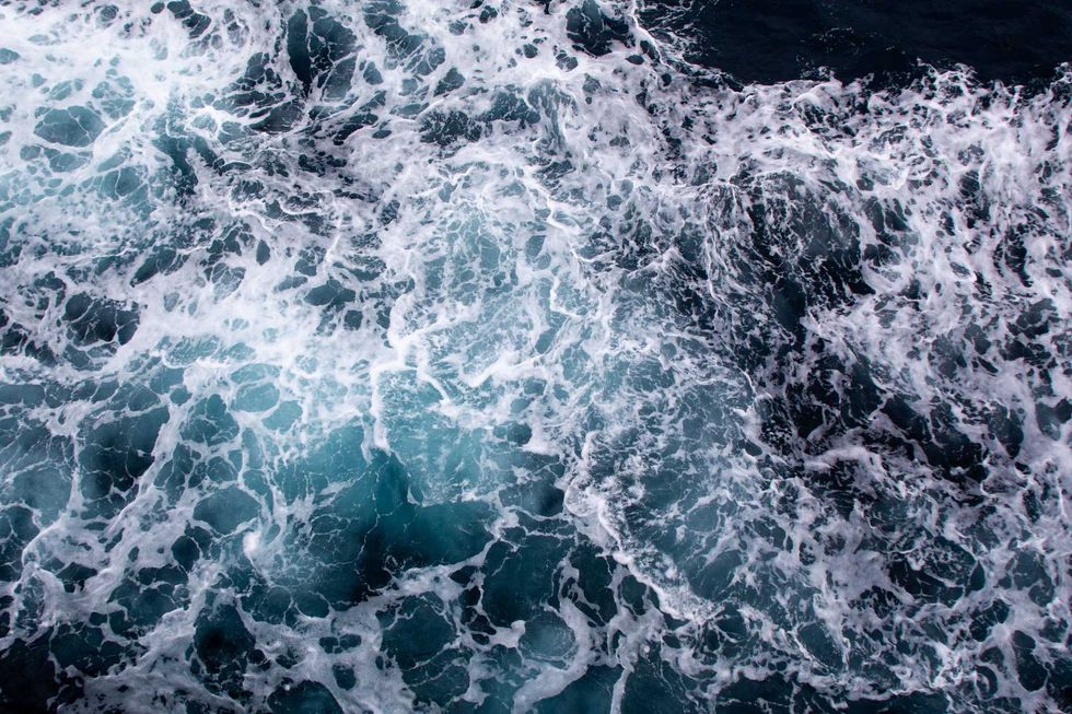 Foamy ocean waves seen from above