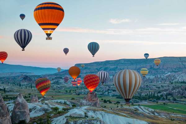 Hot air balloon flying over spectacular Cappadocia - Goreme, Turkey