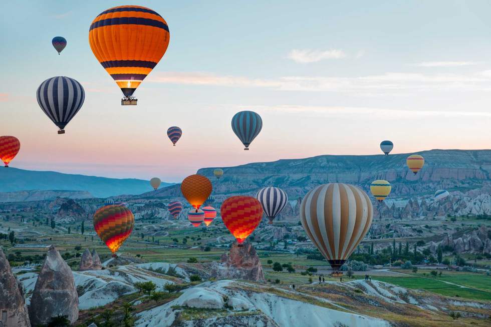 Hot air balloon flying over spectacular Cappadocia - Goreme, Turkey