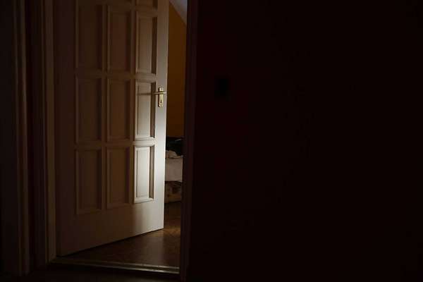 Light coming from a room with door left ajar