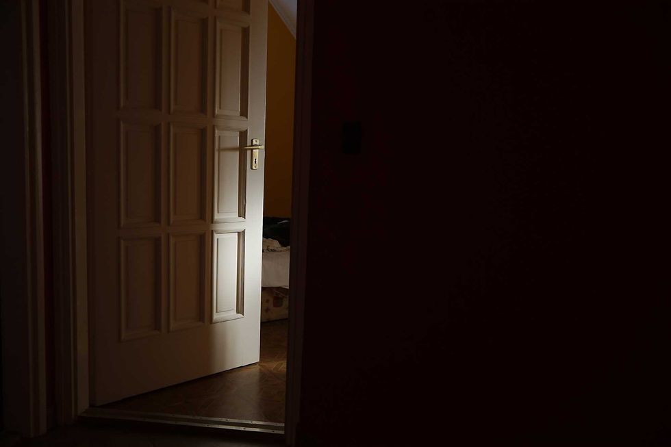 Light coming from a room with door left ajar