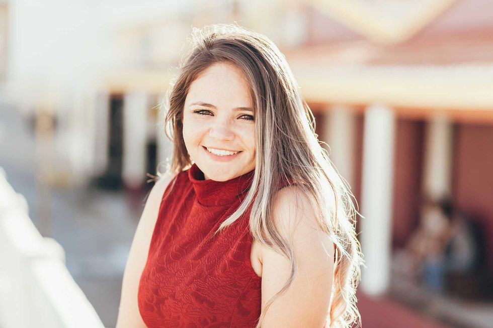 Portrait of happy young woman on sunny day