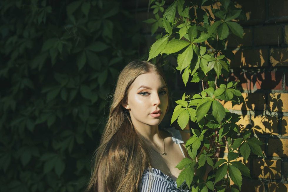 portrait of young woman in spring garden