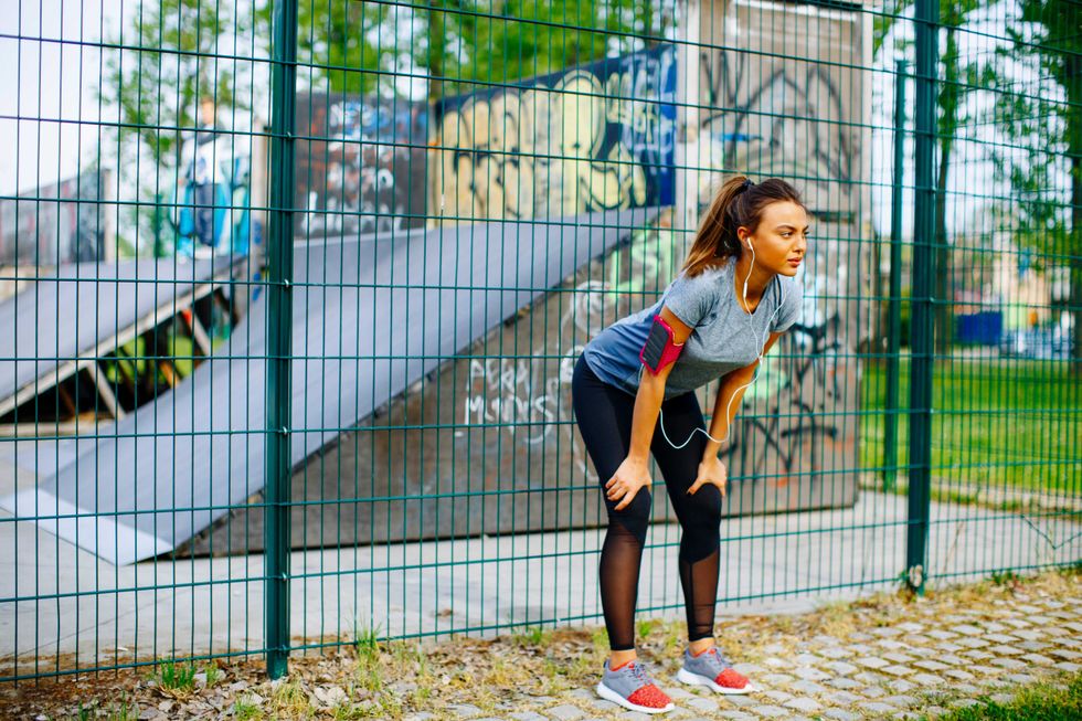 Pretty young woman have training outdoors on a sunny day