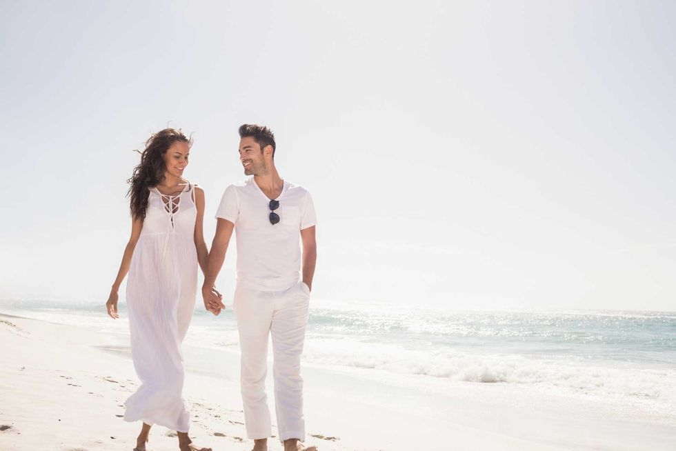 Smiling couple holding hands