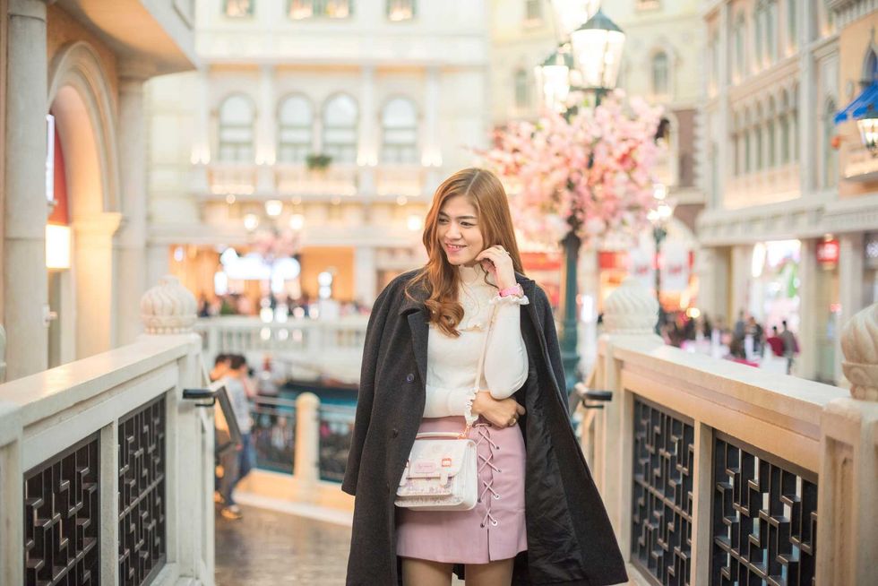Thai girls go sightseeing and take a photo in Macau.