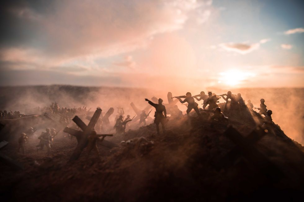 World War 2 reenactment (D-day). Creative decoration with toy soldiers, landing crafts and hedgehogs. Battle scene of Normandy landing on June 6, 1944. Selective focus