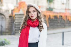 Young beautiful teenage girl in autumn park. Emotions, people, beauty and lifestyle concept. Street photo of young woman wearing stylish classic clothes. Female fashion concept. French style.