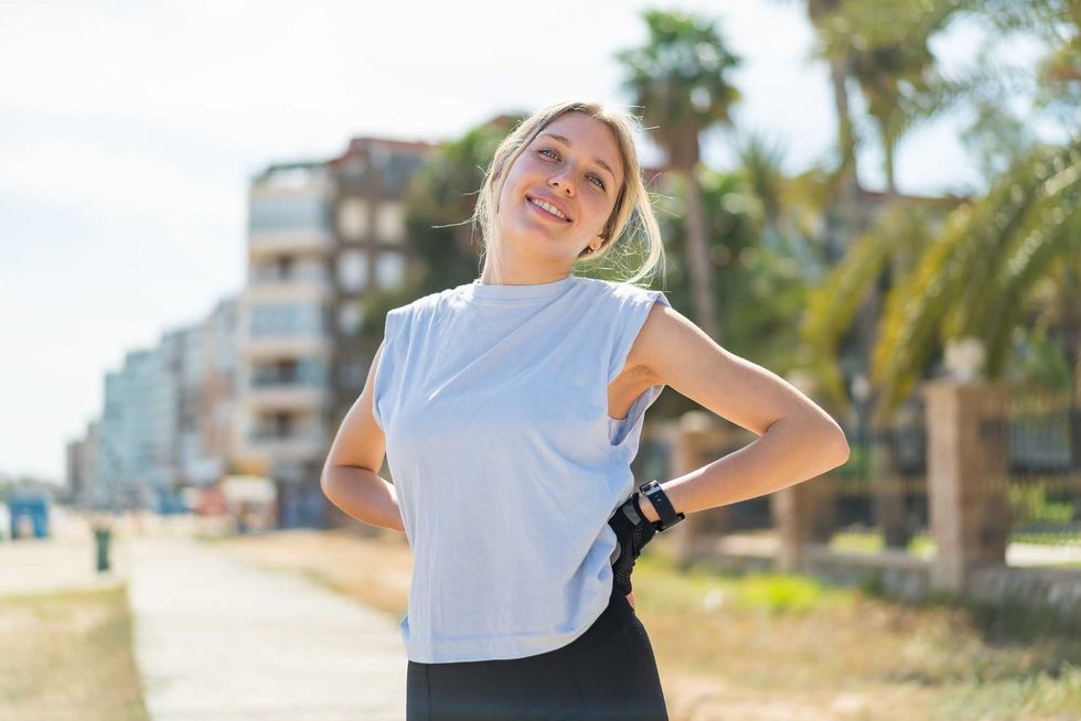 Young blonde woman at outdoors wearing sport wear