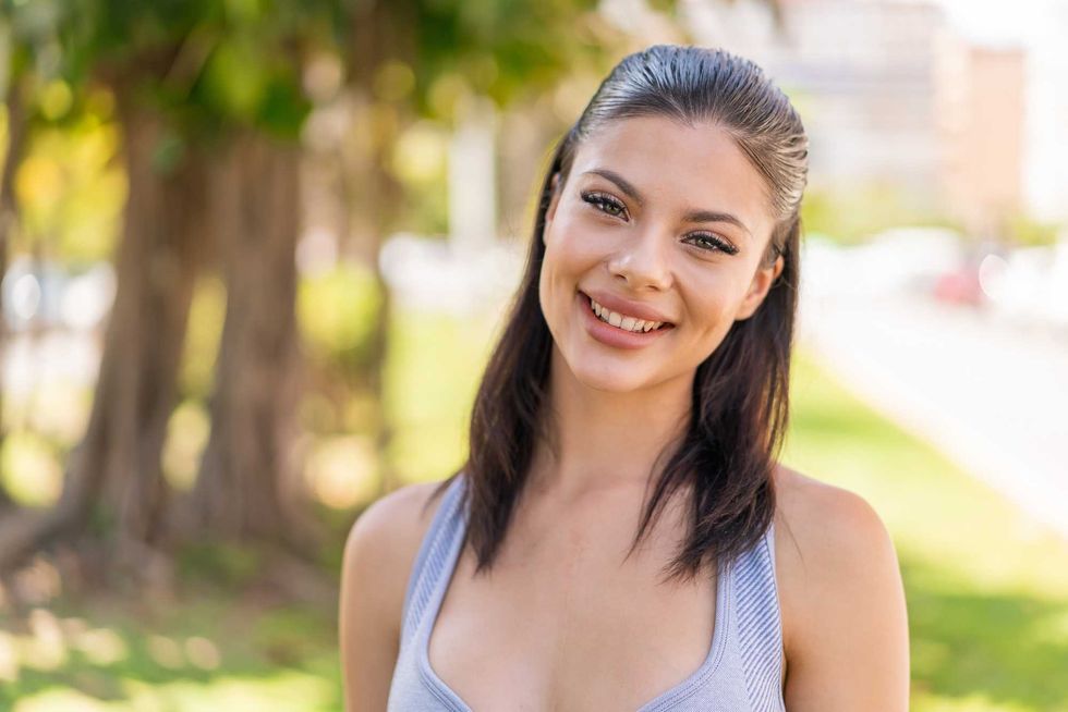Young pretty sport woman at outdoors With happy expression